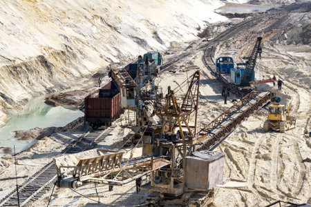 Rotary crawler excavator is mining sand in a clay quarry. Zaporozhye region, Ukraine.