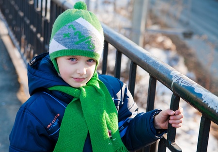 Winter portrait of a young boy with blue eyesの写真素材