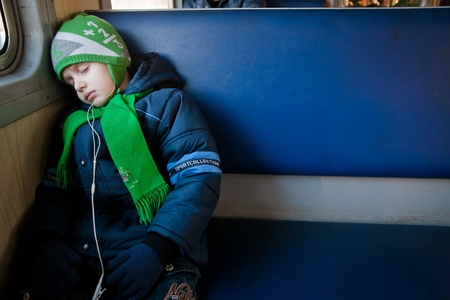 Winter portrait of a young boy with blue eyesの写真素材