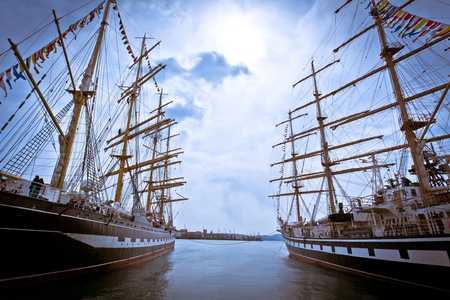 masts of sailing ships lying at the wharf skylineの写真素材
