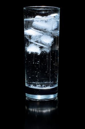 glass of water and ice on a black backgroundの写真素材