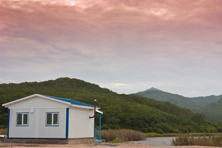 little white house to relax in the azure lakeの写真素材