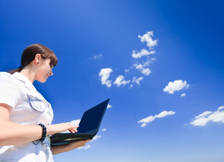 beautiful girl in a business suit with laptopの写真素材