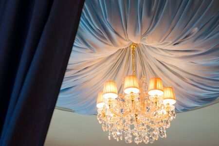 elegant chandelier in the blue ceilingの写真素材