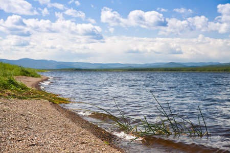 tranquil river bed before sunsetの写真素材