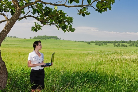 beautiful young girl in a business suit in an outdoorの写真素材