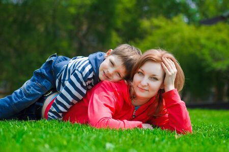Mom and young son in the parkの写真素材
