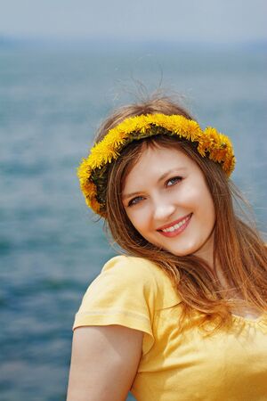 beautiful blonde walks by the seaの写真素材