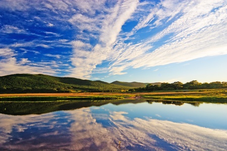 clouds reflected in waterの写真素材