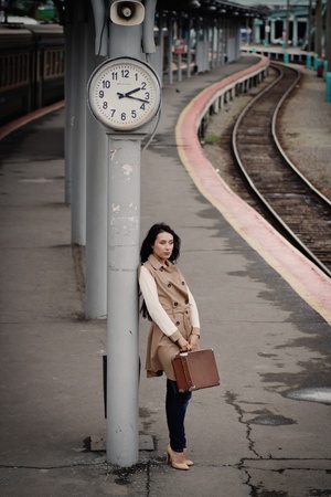 girl with vintage suitcase is in hoursの写真素材