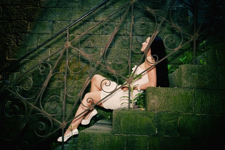 girl with long hair in a deserted townの写真素材