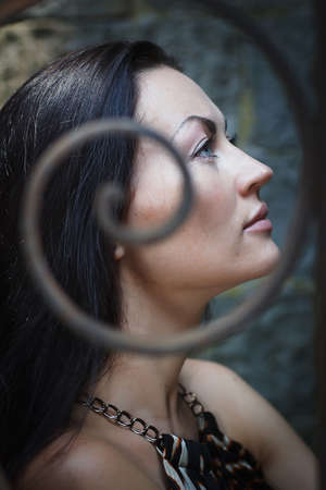 profile girl with dark hair in vintage patternsの写真素材