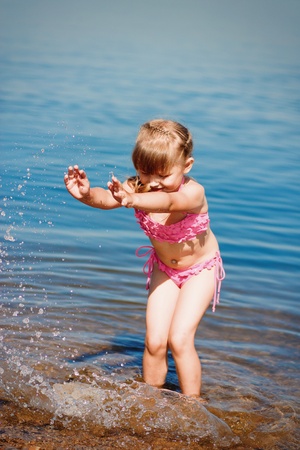 little girl bathed in the seaの写真素材