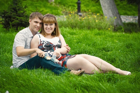 beautiful young family expecting a babyの写真素材