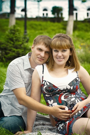 portrait of a beautiful young family in natureの写真素材