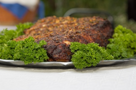 beef steak on a plate with greensの写真素材
