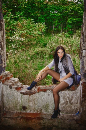 the girl in the old ruins of the houseの写真素材