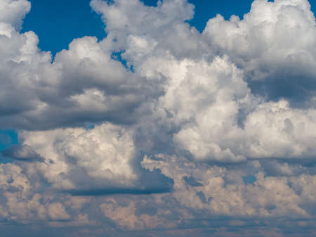 White cumulus clouds in the blue sky