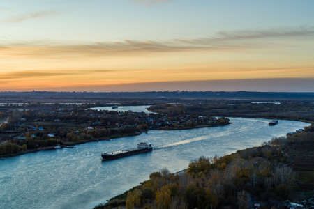 Barge on the river at sunset, beautiful landscape, aerial view