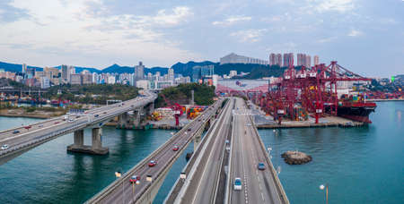 Hong Kong, China - 2020: Tsing Yi South Bridge, ship with containers from above