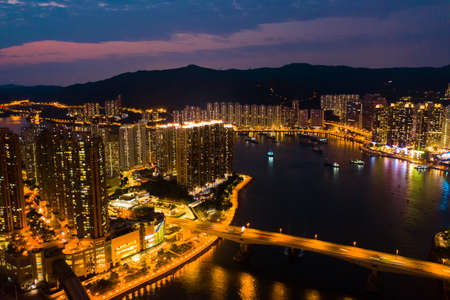 Hong Kong, China - 2020: bridge and buildings at night, aerial viewのeditorial素材