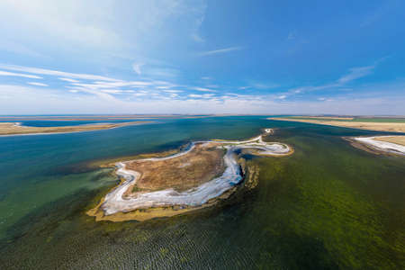 Aerial view to the island in the middle of Manych-Gudilo lake. The largest salt lake, bird nesting on the island, amazing nature, nature reserve in Russia from above.の写真素材
