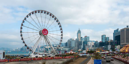 Hong Kong, China - 2020: The Hong Kong Observation Wheel and AIA Vitality Park, aerial view. Skyscrapers in the background.のeditorial素材