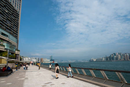 Hong Kong - 2020: Avenue of Stars, near K11 MUSEA, view of Victoria Harbor. People walk and take pictures on the promenade.のeditorial素材
