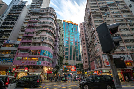 Hong Kong - 2020: Hong Kong streets, Lockhart Street and Stewart Road, typical residential buildings, Emperor Group Center office building.のeditorial素材