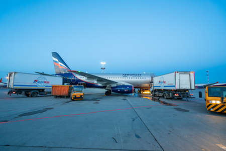 Moscow, Russia - 2020: Sheremetyevo International Airport, Aeroflot aircraft, aircraft maintenance and baggage loading.のeditorial素材