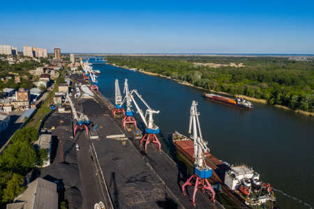 Rostov-on-Don, Russia - 2020: Don river, barges, port and cranes, coal loading, aerial view.のeditorial素材