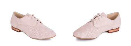 Pair of classical daily woman beige leather suede Oxford boots booties shoes. Two isolated.の写真素材