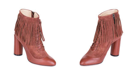 Pair of classical brown woman high ankle cowboy suede boots shoes. Two isolated.の写真素材