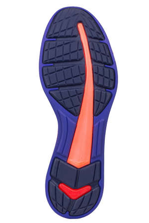 Sole of sport tracking shoes snickers individual design close up isolated one stylish and bright orange blue and black patternの写真素材