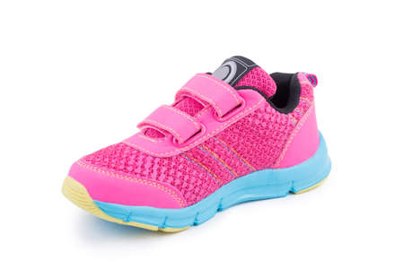 One colorful pink blue sole bright leather fiber, fabric toddler laced orthopedic footwear snickers shoe boot isolatedの写真素材
