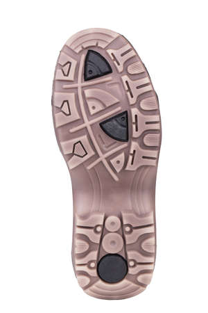 Sole of sport tracking shoes snickers individual design close up isolated one stylish brown and black patternの写真素材