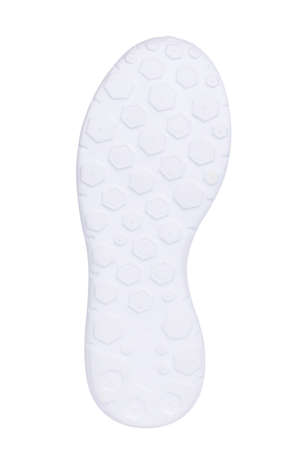Sole of sport tracking shoes snickers individual design close up isolated one pure whiteの写真素材