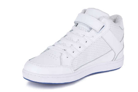One white laced breathing orthopedic leather casual ankle hipster style 80's 90's style sneakers shoe isolated on white backgroundの写真素材