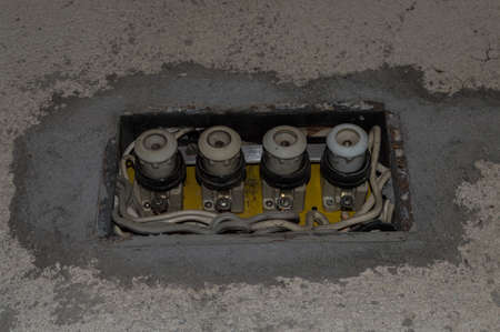 An old broken and dusty fusebox