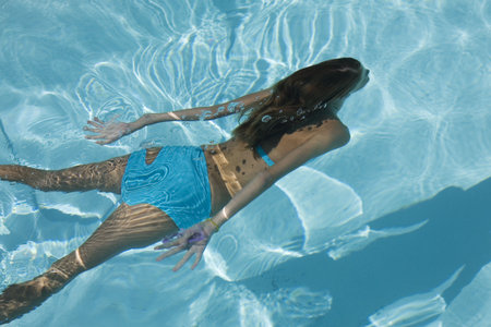 Model Release 358  Young girl swimming under water
