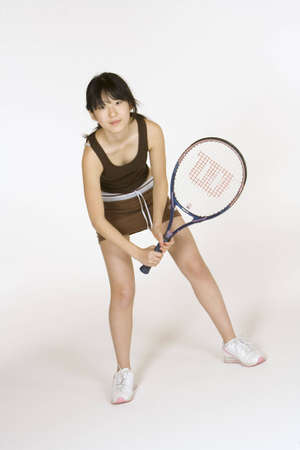 Model Release 302  Asian teen holding a tennis racquetの写真素材