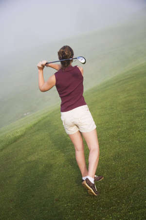 Model Release 353 Woman in her mid 20s playing golfの写真素材