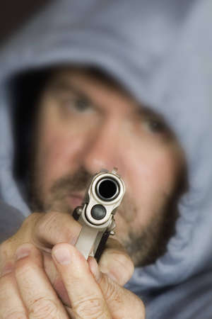 Model Release 355 Man hold gun in a threatening pose