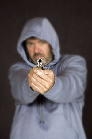 Model Release 355 Man holding a gun in a threatening pose
