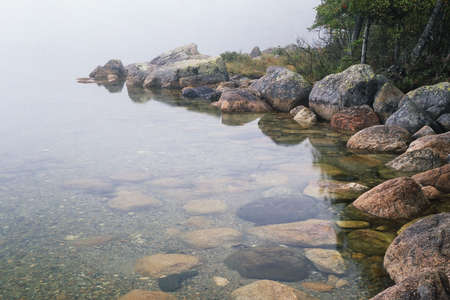 Early morning fog on Jordon Pond, Acadia National Pond, Maine, United Statesの写真素材