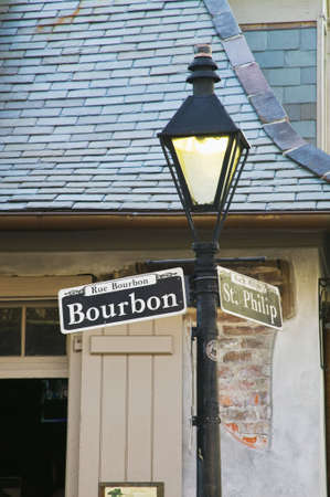 Bourbon Street sign with the haunted Lafitte's Blacksmith Shop in the background, New Orleans, Louisianaの写真素材