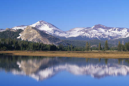 Mountain range reflected in alpine lake