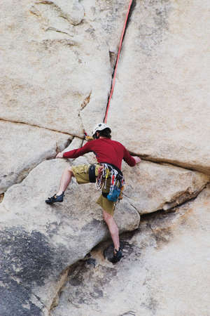 Man rock-climbing in Joshua Tree National Park. California...No Releaseの写真素材