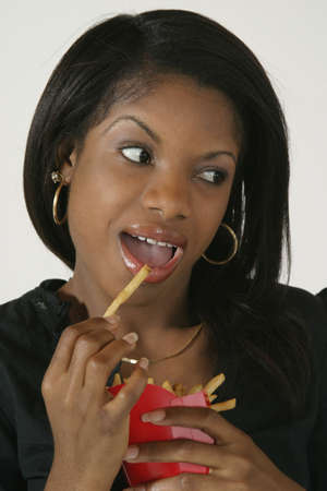 Model Release #278  African American Woman in early 20's eating junk foodの写真素材