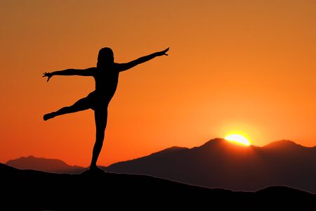 Young woman relaxing with early morning Yogaの写真素材